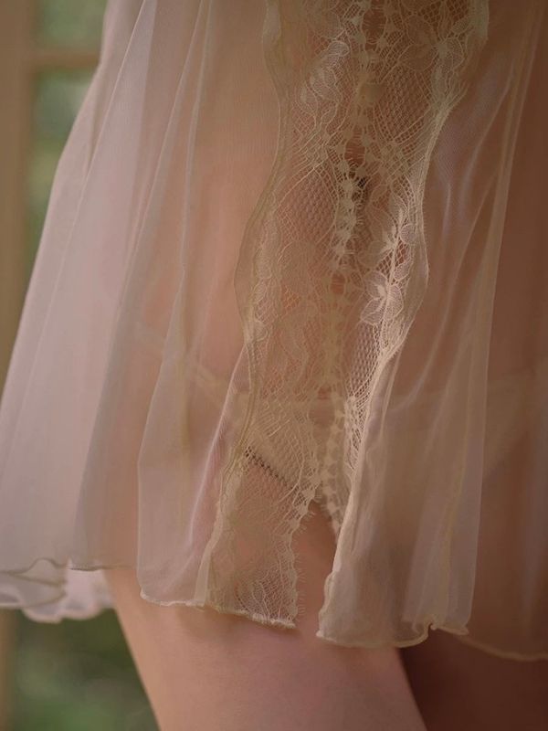 Close-up of a lace-trimmed garment with a blurred background