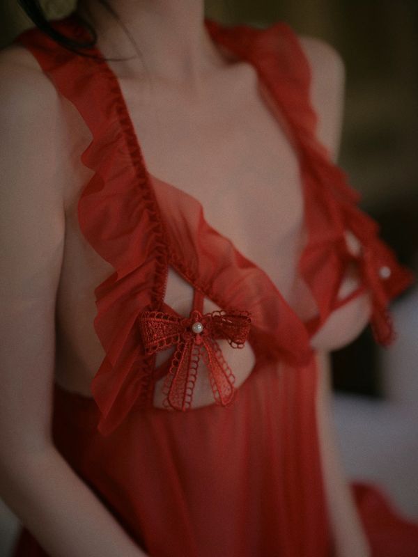 Red dress with intricate detailing on a blurred background