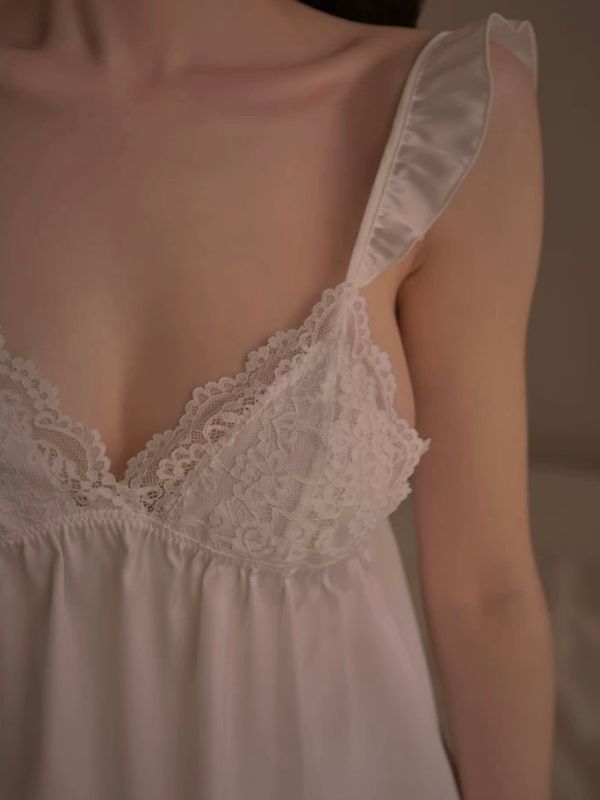 Light pink lace-trimmed nightgown on a neutral background