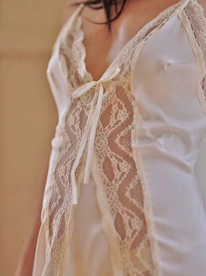 White lace-trimmed top with a blurred background