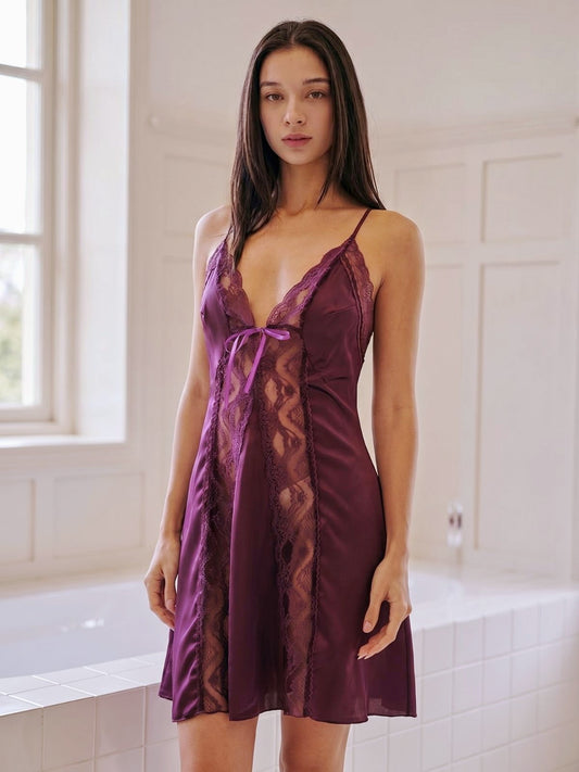 Woman wearing a purple lace nightgown in a bathroom.