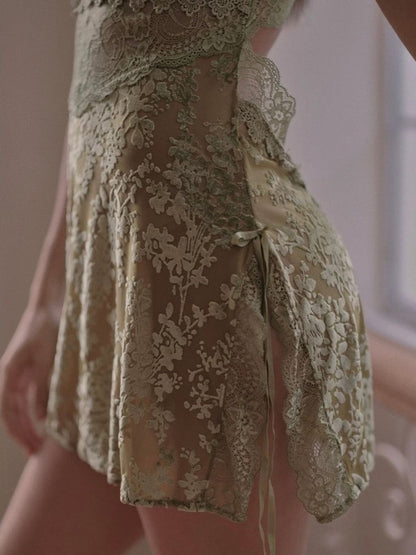 Close-up of a green velvet lace lingerie with a neutral background.