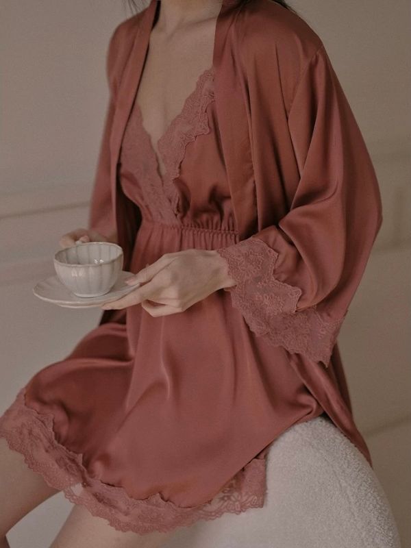 Woman in a brown satin chemise and robe